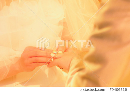 Bride exchanging rings 79406816