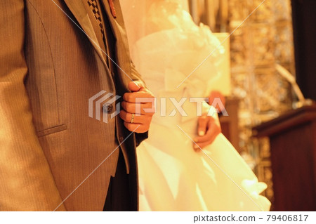 Bride and groom proclaiming vows at the chapel 79406817