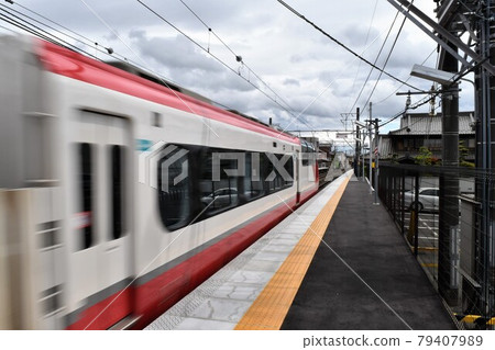 Limited express train passing through the station 79407989