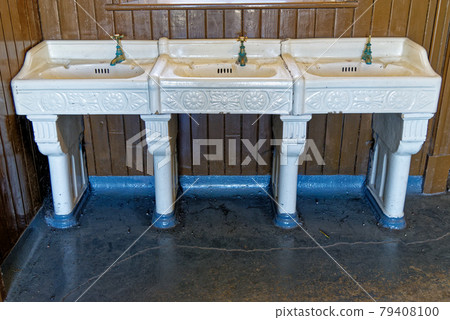 Washroom with sinks and faucets in an old school in Beamish Village - United Kingdom Washroom with sinks and faucets in an old school in Beamish Village - United Kingdom 79408100