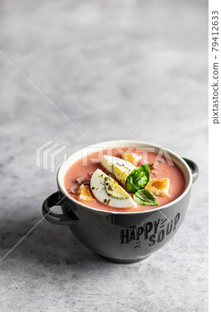 Spanish salmorejo soup in bowl on gray background 79412633