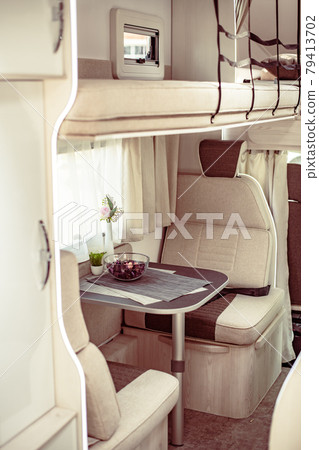 Trailer or car house on wheels in an mobile home. Interior inside table, armchairs 79413702