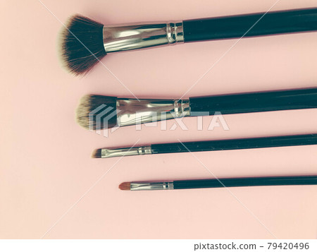 brushes on a pink background. makeup artist tool. brushes for powder, foundation and contouring. make-up art. beauty for girls and guys brushes on a pink background. makeup artist tool. brushes for powder, foundation and contouring. make-up art. beauty for girls and guys 79420496