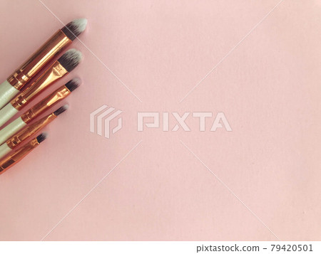 makeup brushes on a pink background. different brushes for applying textures to the face. keg eyeshadow brush, flat lipstick brush, fine eyeliner brush makeup brushes on a pink background. different brushes for applying textures to the face. keg eyeshadow brush, flat lipstick brush, fine eyeliner brush 79420501