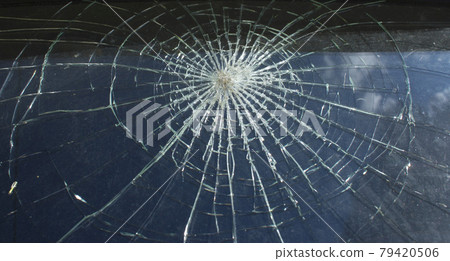 Broken glass over natural black background. Broken glass over natural black background. 79420506