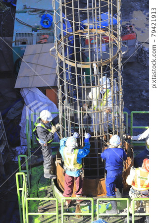 Construction site: Foundation work: Guide pipes and rebar connection work 79421913