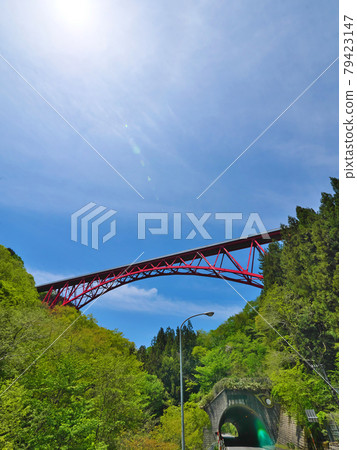 Red bridge between blue sky and mountains Okuizumo Orochi Loop 79423147