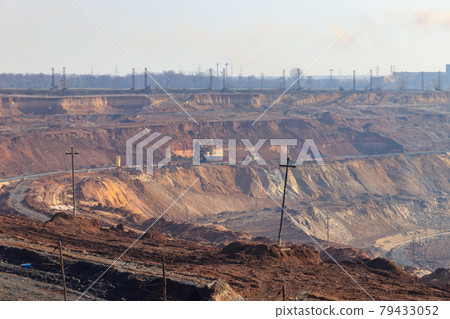Big yellow excavator working in iron ore quarry Big yellow excavator working in iron ore quarry 79433052