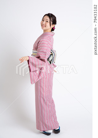 A young Japanese woman wearing a small crest and posing A young Japanese woman wearing a small crest and posing 79433182