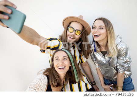 Stylish friends taking selfie photo on phone 79435126
