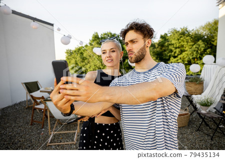 Two friends hanging out at picnic outdoors 79435134