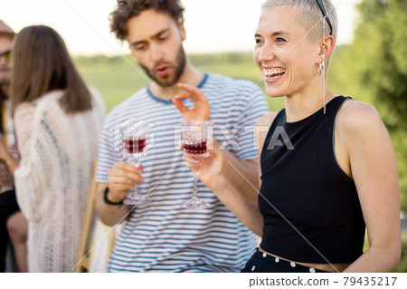 Two friends hanging out at picnic outdoors Two friends hanging out at picnic outdoors 79435217
