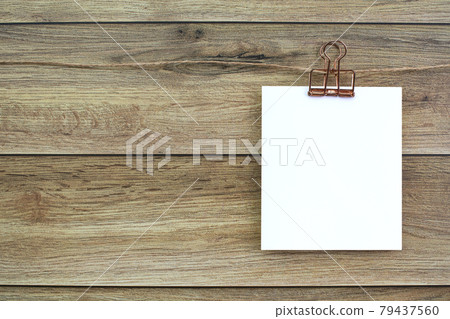 Blank polaroid notepad hanging on the wall Blank polaroid notepad hanging on the wall 79437560
