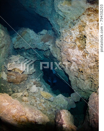Scuba diver diving underwater cave (Playa del Carmen, Mexico) Scuba diver diving underwater cave (Playa del Carmen, Mexico) 79438203
