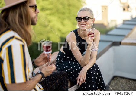 Two friends hanging out at picnic outdoors Two friends hanging out at picnic outdoors 79438267