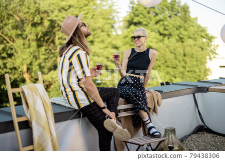 Two friends hanging out at picnic outdoors 79438306