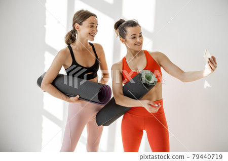 Sports women making selfie at gym 79440719