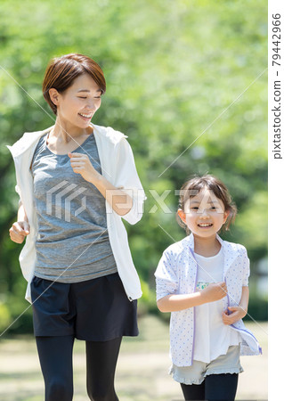 Jogging parent and child family image 79442966