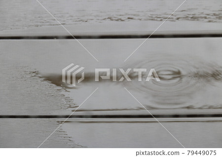 Rain on the wooden deck 79449075