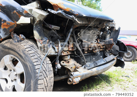 Front of blue car was accidentally damaged on road closeup 79449352