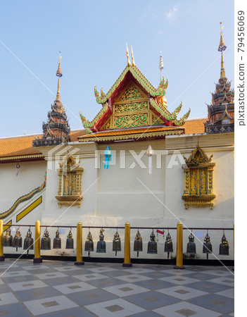 Old brass bell in a row behind the Thai church. Old brass bell in a row behind the Thai church. 79456069