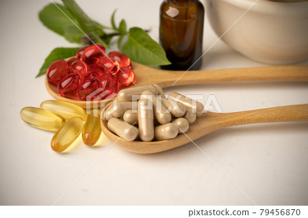 Alternative medicine herbal organic capsule with vitamin E omega 3 fish oil, mineral, drug with herbs leaf natural supplements for healthy good life. 79456870