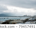 Light shining through a cloud cave at the beach in the evening 79457491