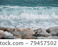 Blue-green waves rolling on the seashore 79457502