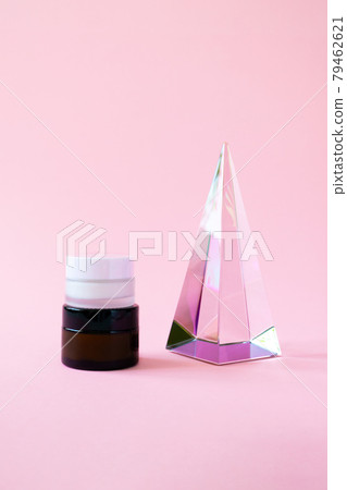 Set moisturizer cream jars and glass pyramid prism on pink background with copy space, vertical. Beauty skin care cosmetic products trendy minimalism Set moisturizer cream jars and glass pyramid prism on pink background with copy space, vertical. Beauty skin care cosmetic products trendy minimalism 79462621