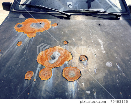 Old broken car with large rusty spots Old broken car with large rusty spots 79463156