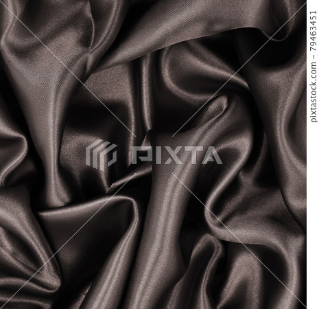 Smooth elegant brown silk or satin texture as abstract background. Luxurious background design. Sepia toned. Retro style Smooth elegant brown silk or satin texture as abstract background. Luxurious background design. Sepia toned. Retro style 79463451