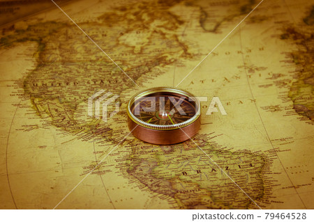 Compass on a vintage world map. Retro style Compass on a vintage world map. Retro style 79464528