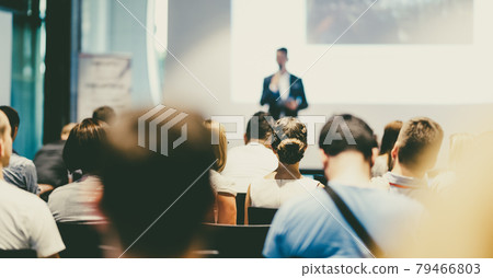 Male business speaker giving a talk at business conference event. 79466803