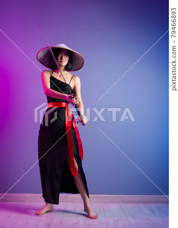 slender Asian woman an Asian hat with a katana in her hand image of a samurai slender Asian woman an Asian hat with a katana in her hand image of a samurai 79466893