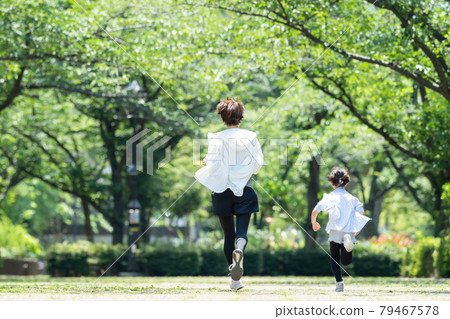 Jogging parent and child family image Jogging parent and child family image 79467578