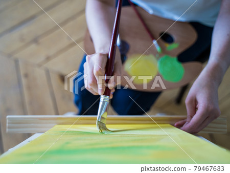 A student of the art college paints a picture. Learning to draw 79467683