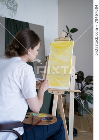 A creative young entrepreneur. Artist works in a creative workshop 79467684