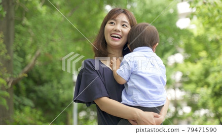 Parents walking in the park 79471590