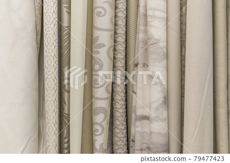 multicolored textures of fabrics on the shelves of stores close-up multicolored textures of fabrics on the shelves of stores close-up 79477423
