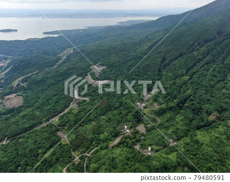 Aerial view of Sabo dam on the hillside of Sakurajima from the sky above Higashisakurajima-cho Aerial view of Sabo dam on the hillside of Sakurajima from the sky above Higashisakurajima-cho 79480591