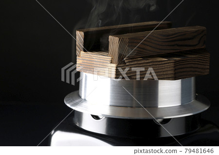A picture of rice being cooked in a one-go cooking pot on a black background A picture of rice being cooked in a one-go cooking pot on a black background 79481646