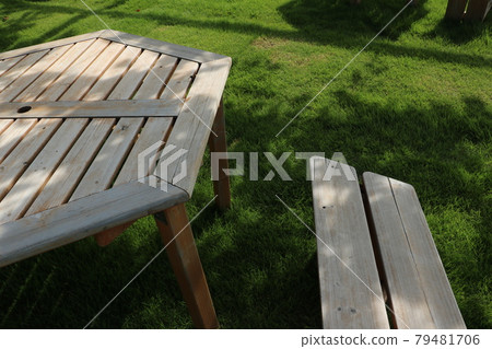 Shady wooden tables and benches in the garden 1 79481706