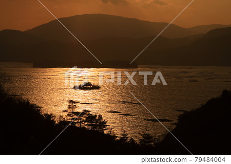 Ferry sailing between oyster rafts 79484004