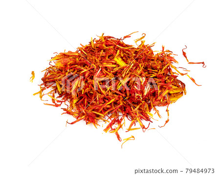handful of dried safflower petals closeup on white 79484973