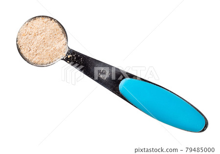 ground asafoetida in measuring spoon cutout 79485000