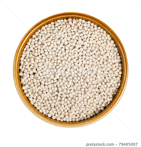 uncooked ptitim (pearl couscous) in bowl cutout 79485007