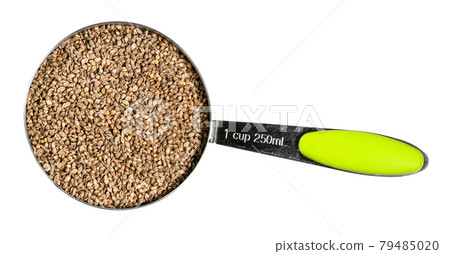 unhulled barnyard millet seeds in measuring cup unhulled barnyard millet seeds in measuring cup 79485020