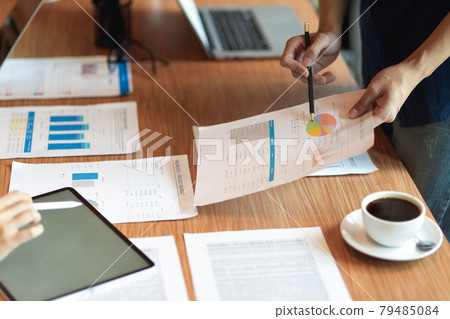 Close up hands, Consulting in the meeting room with tablet and financial report 79485084