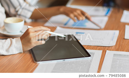 Close up business team using tablet with stylus pen 79485086
