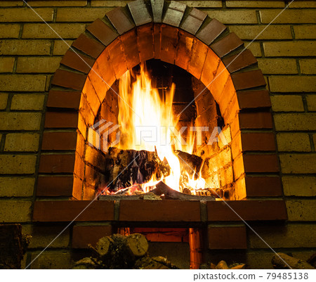 bottom view of fireplace with burning firewood bottom view of fireplace with burning firewood 79485138